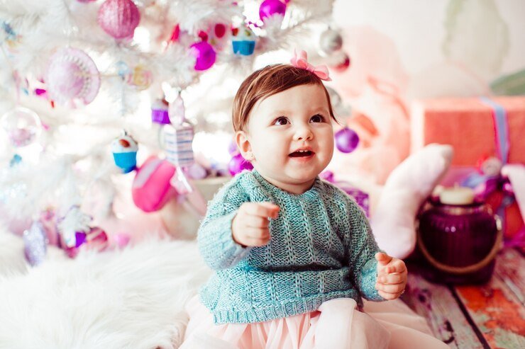 littlle-girl-mint-dress-sits-before-white-christmas-tree_8353-947-1.jpg